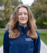 Annabel Marshall, blonde haired female student wearing UC Davis blue jacket