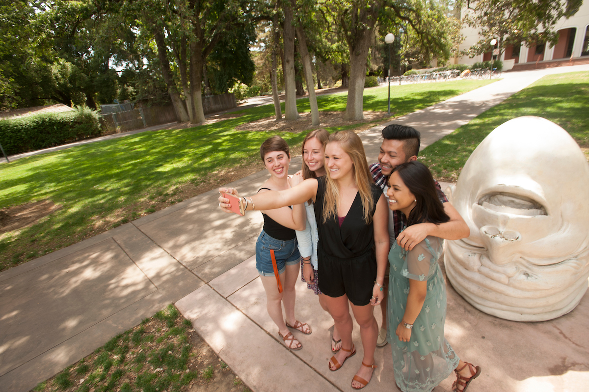 Photo: students taking selfie with Arneson Egghead "Eye on Mrak"