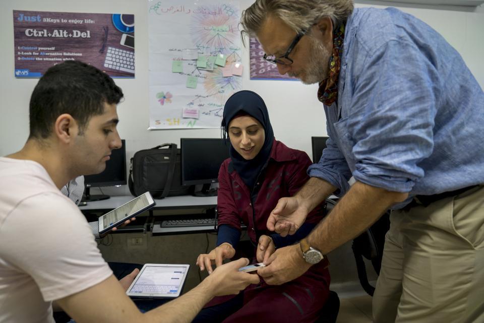 photo of Keith Watenpaugh working with refugee students