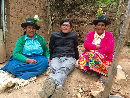 UC Davis history grad student Renzo Aroni with two village women in traditional dress