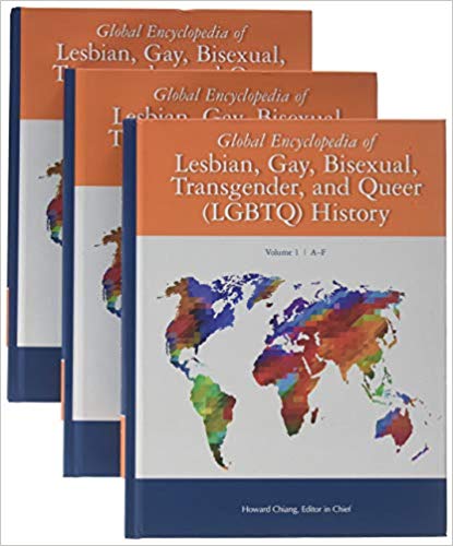 Stack of three books with rainbow world map