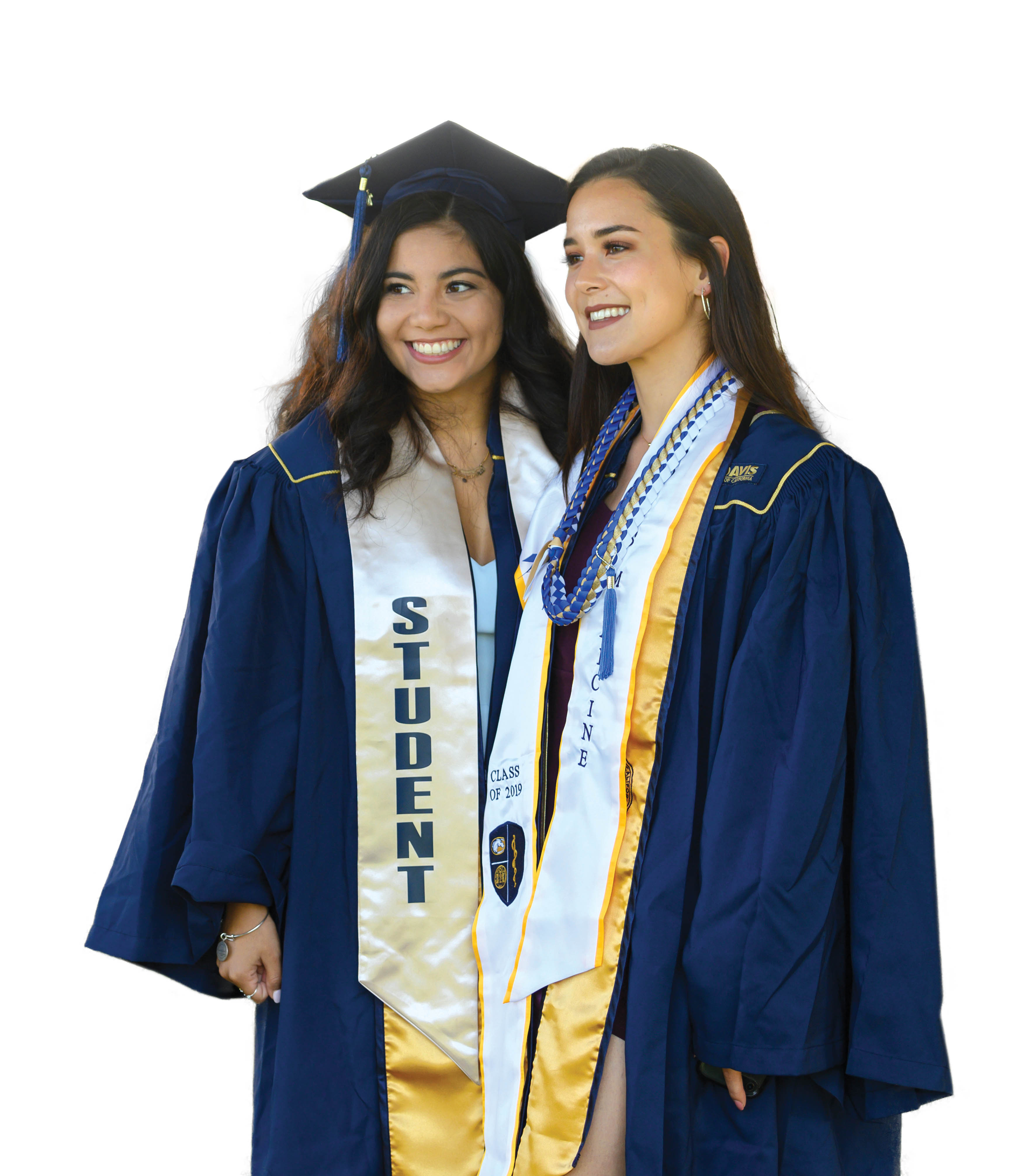 Photo of two young female graduating students in commencement gowns