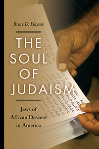 Book cover with image of African American hands holding pages of Hebrew text