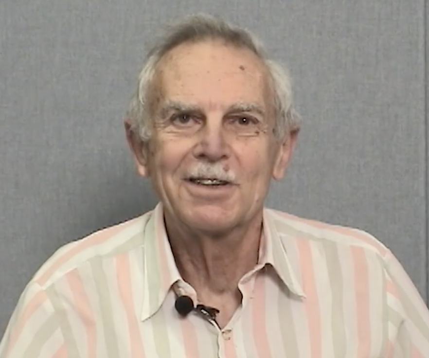 Portrait photo of UC Davis psychology professor Robert Sommer with short gray hair and a striped shirt.