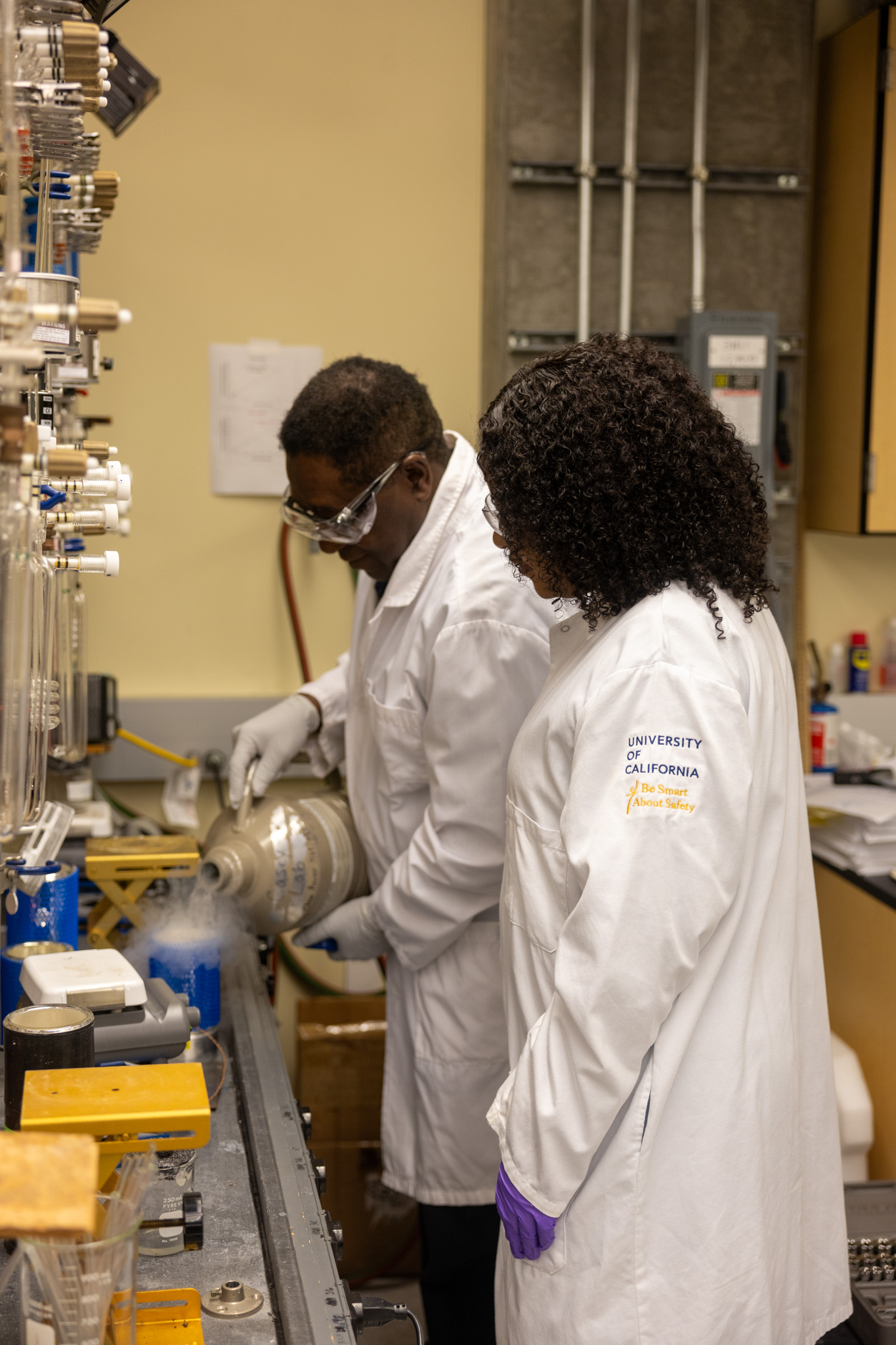 Goabaone Jaqueline Ramatlapeng and her mentor Professor Eliot Atekwana stand in the lab. 