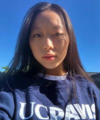 Kay Xiong, wearing UC Davis blue sweat shirt