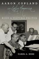cover of book black and white photo of group of five men gathered around a piano two seated and three standing looking over thier shoulders. At the top of the image is the title of the book Aaron Copland in Latin America Music and Cultural Politics