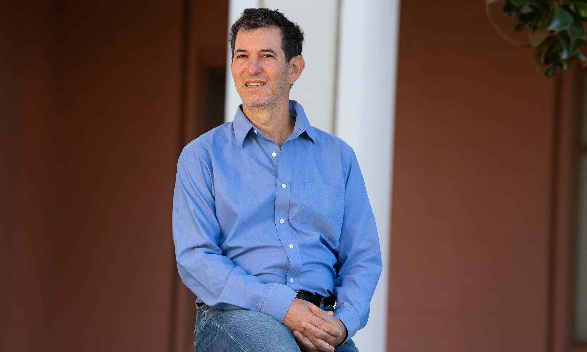 UC Davis psychology professor Richard Robins in a blue shirt, outdoors on campus
