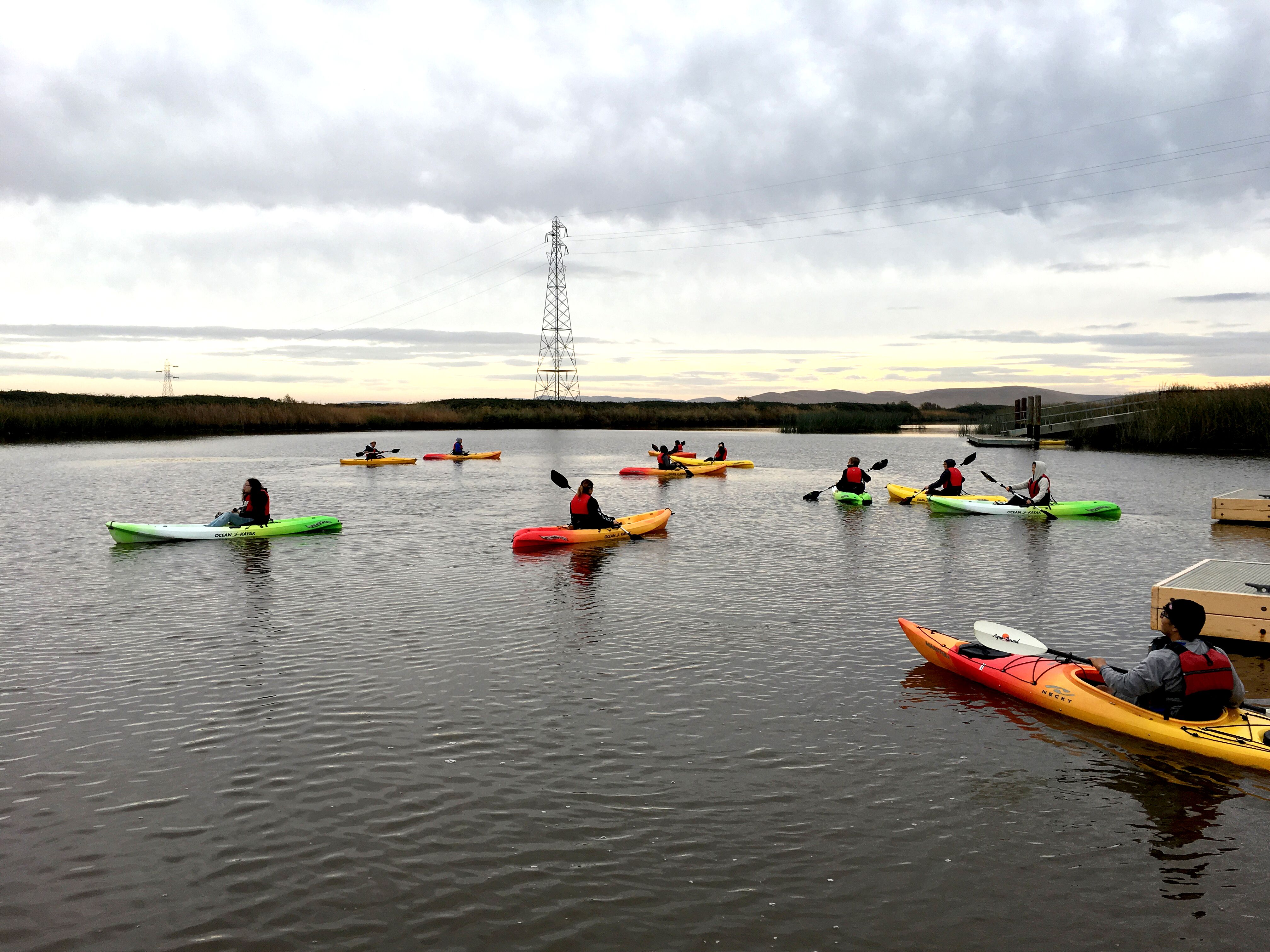 students study in kayaks