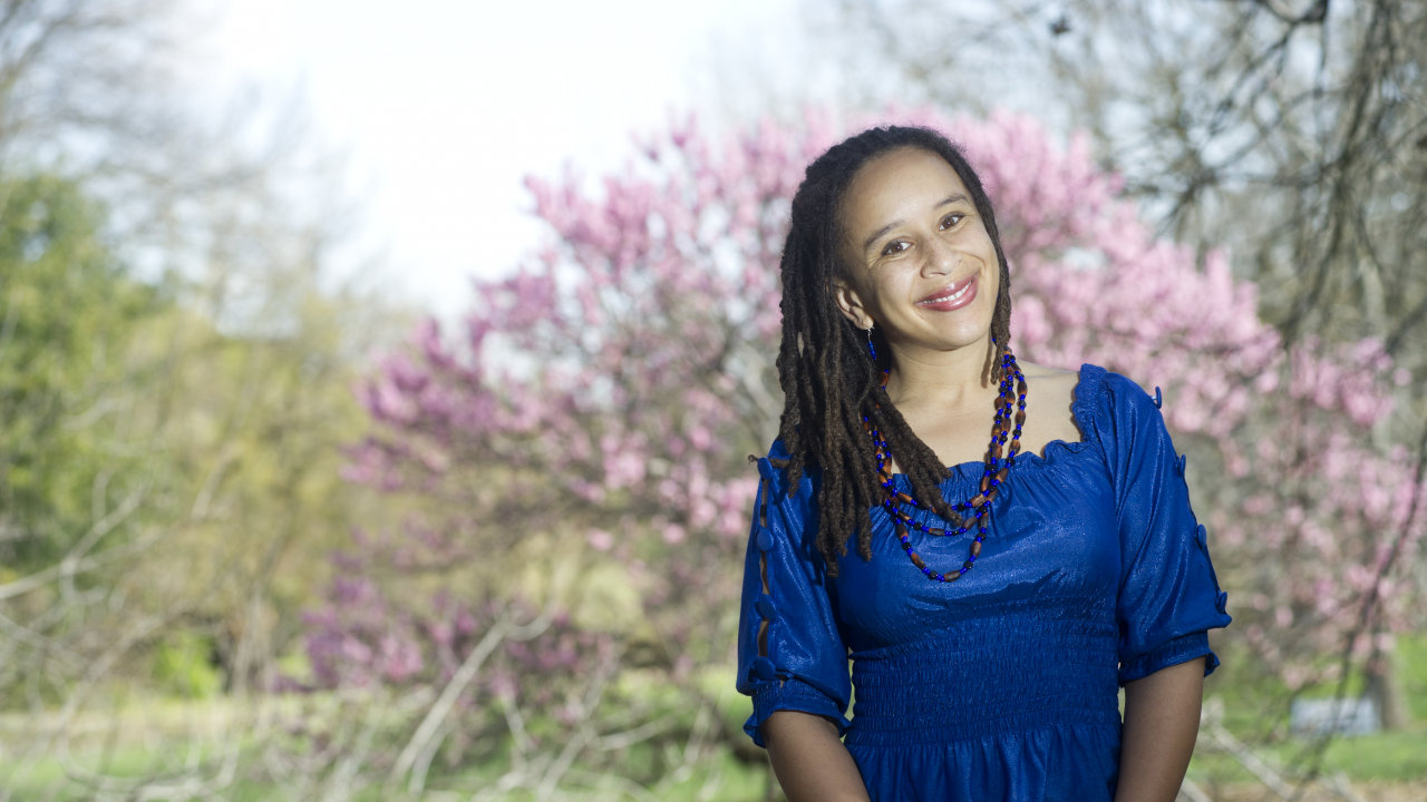 Beth Rose Middleton in the Department of Native American Studies is one of five new Chancellor's Fellows in the UC Davis College of Letters and Science. Photo of UC Davis professor standing outside with blossoming tree in background