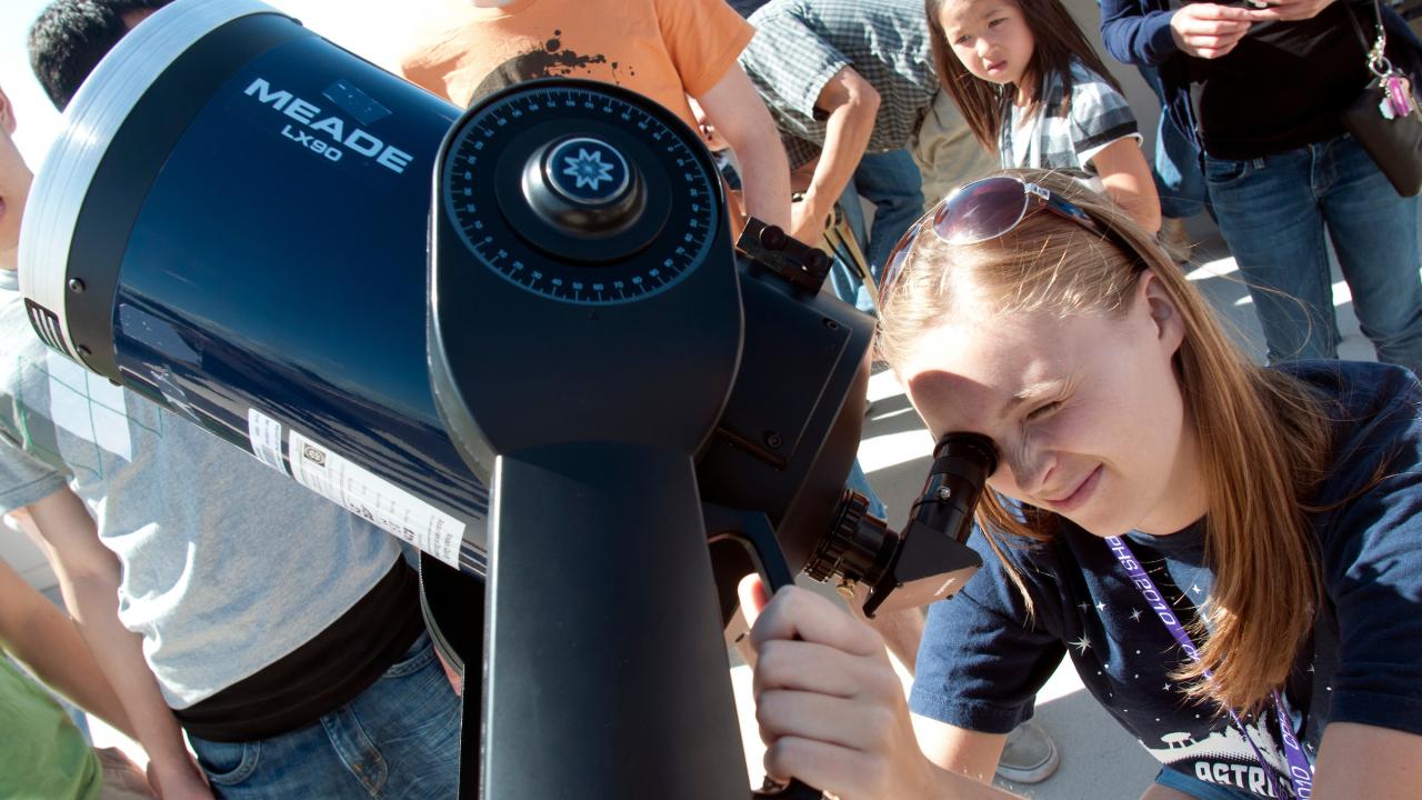 Kaelynn Rose, a sophmore geology major, adjusts the telescope during the Transit of Venus across the Sun on Tuesday June 5, 2012 at UC Davis.  