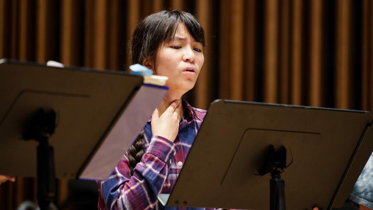 picture of Mira Huang at music stand singing UC Davis