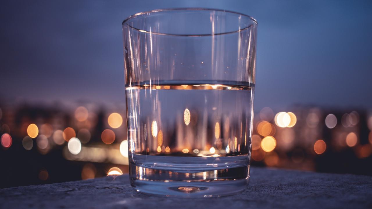 Photo of half full glass on a table