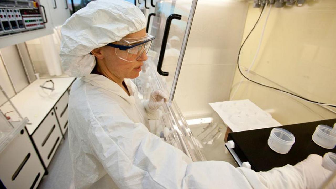 Professor Kari Cooper works in laboratory.