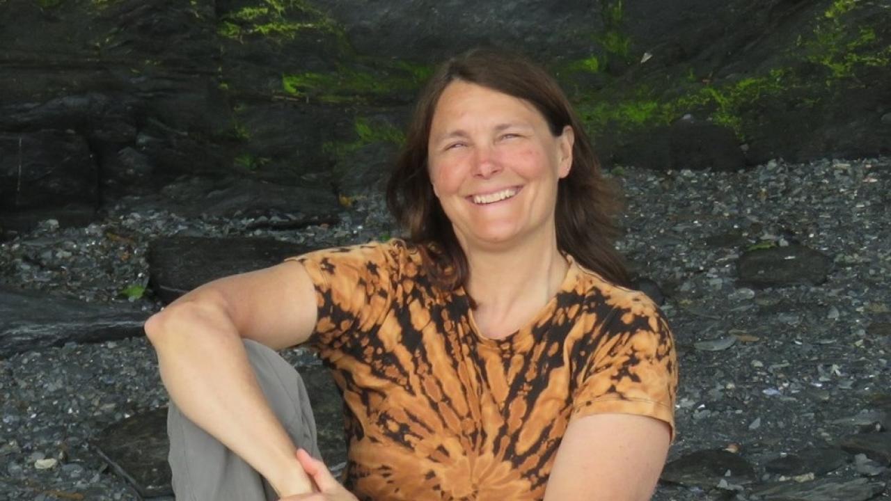 Laura Marsh, a 1985 alumna of the UC Davis College of Letters and Science, is the winner of the college's 2020 Maurice Prize for Fiction. Photo of UC Davis alumna Laura Marsh sitting oudoors