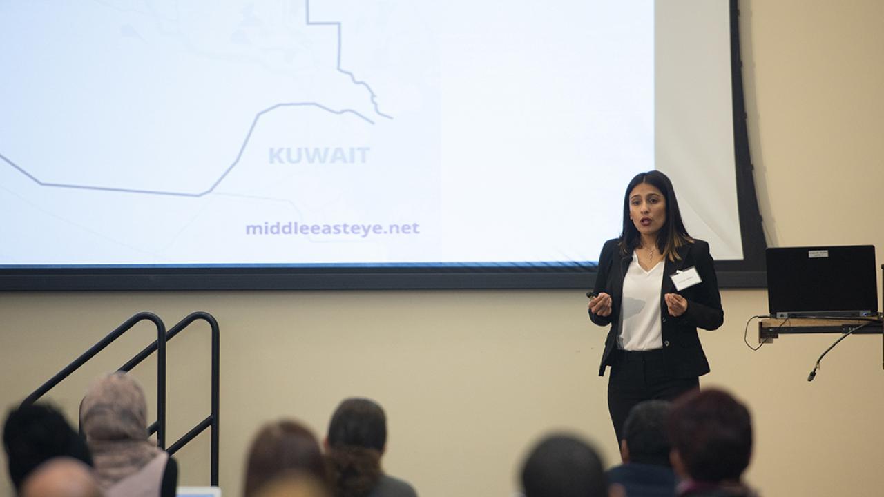 Photo: UC Davis political science grad student talking to audience