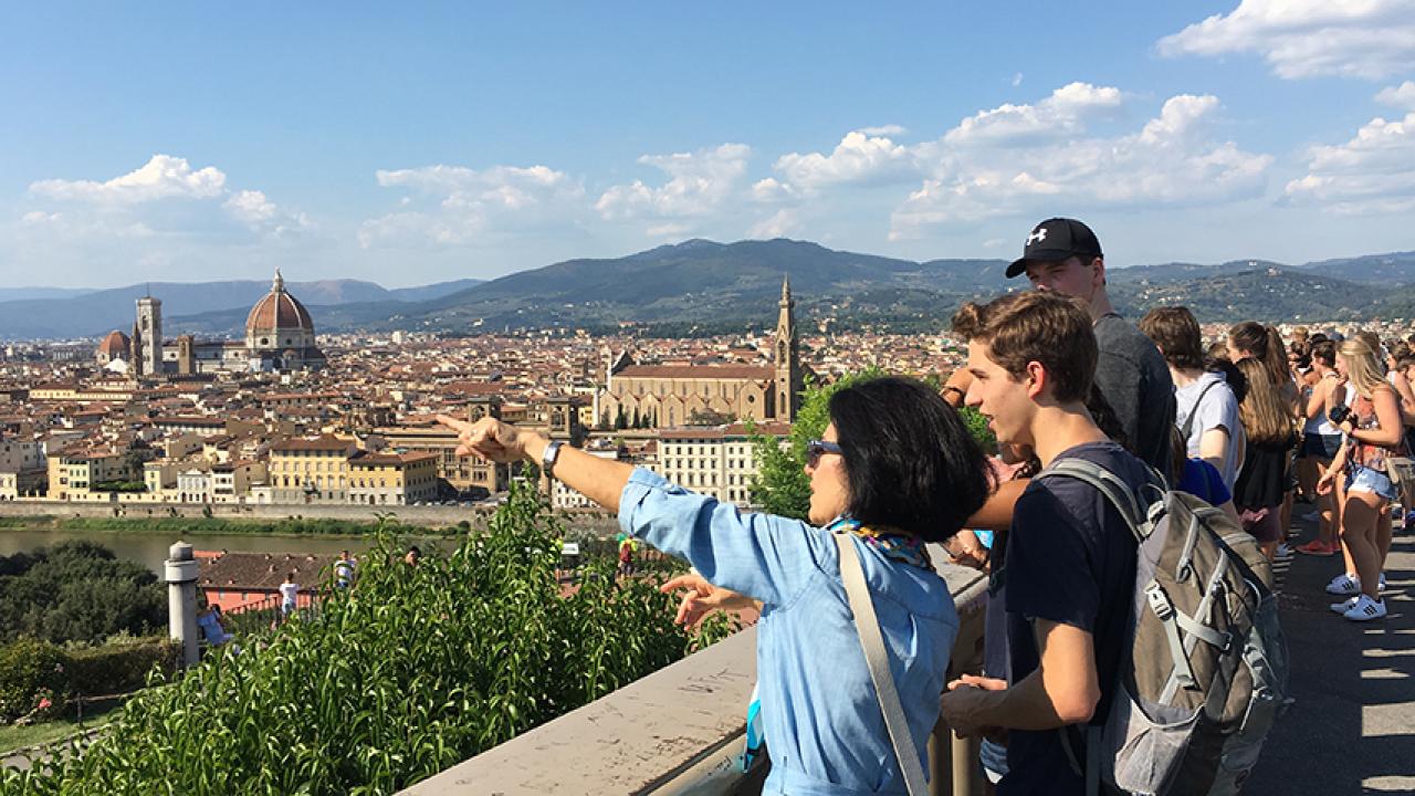 Photo of UC Davis professor and students looking over Florence, Italy