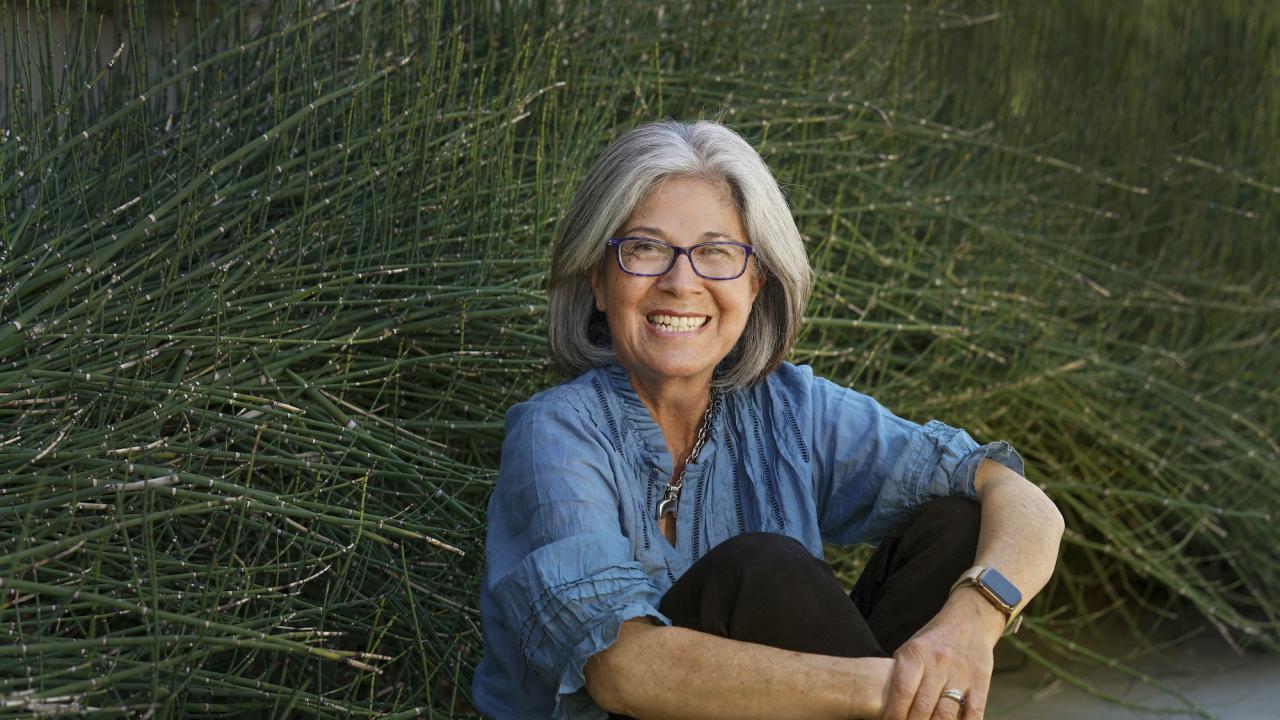 Isabel Montañez, UC Davis professor in the Department of Earth and Planetary Sciences, sitting in front of plants 