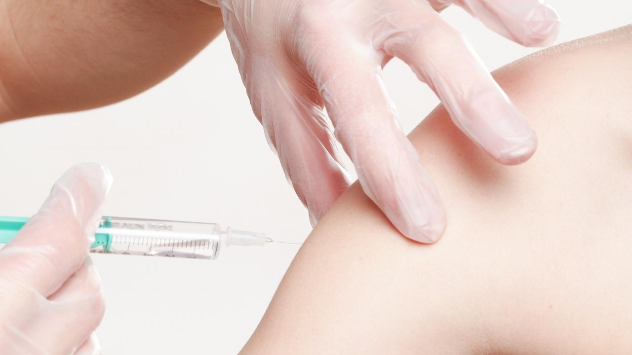 Close-up of vaccine being injected into upper arm