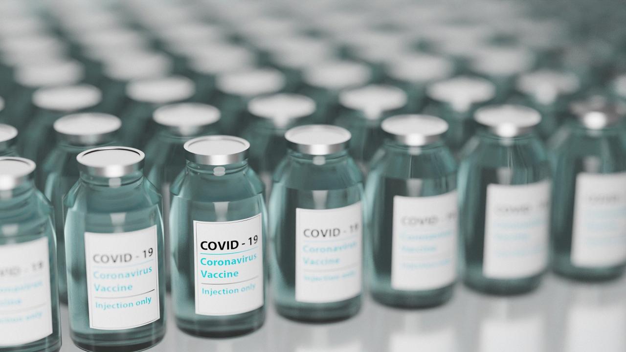Vials of COVID vaccines lined up on a countertop