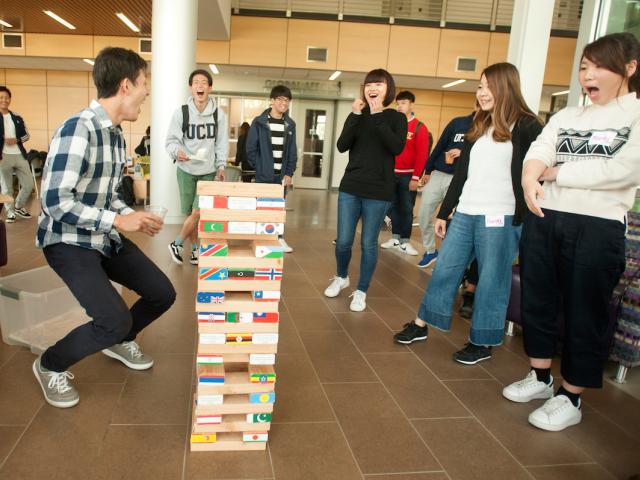 students playing game at international student center
