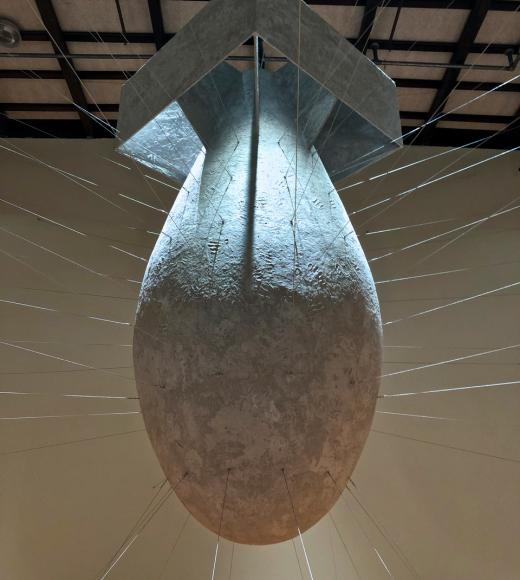 A paper mache sculpture of the Fat Man atomic bomb