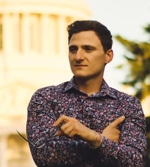 Sertan Usanmaz with folded arms in front of California State Capitol