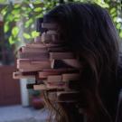 Image from The Mandela Effect movie with Jenga pieces coming out of a face