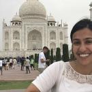 Photo of UC Davis political science graduate student in front of India's Taj Majal 