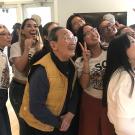 Isao Fujimoto takes a selfie with students at a recent event honoring him. 