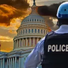 A picture of the Capitol Building with a police officer in the foreground
