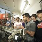 A group of students looking at equipment in the Crocker Nuclear Laboratory at UC Davis.