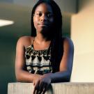 African American and African studies major Tiana Williams stands arms crossed.