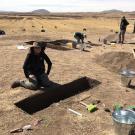Archaeology Field School student Izzie Guerrero excavates a 9,000-year-old archaeological site at 12,600 feet in the Andes Mountains of Peru.