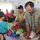 Food aid workers distributing packaged food
