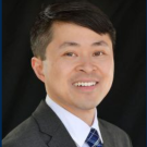 Portrait photo of UC Davis comparative literature Ph.D. alumnus Christopher Tong, smiling. 