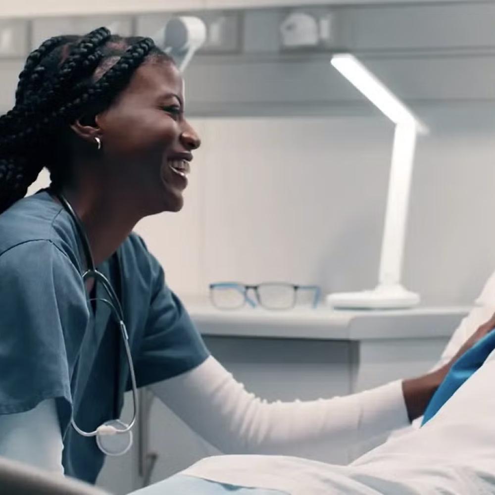 Doctor/nurse caring for patient