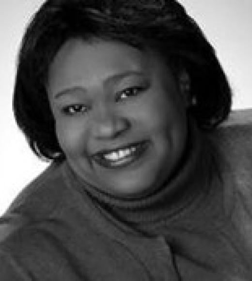 Patricia smiling in black and white