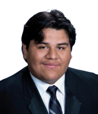 Headshot portrait, young man with dark hair wearing suit and striped tie, slight smile