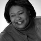 Patricia smiling in black and white