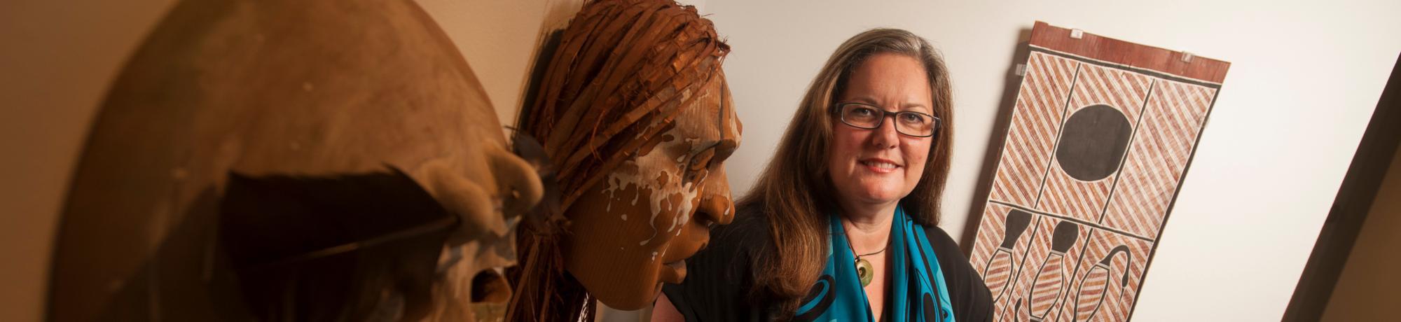 Veronica Passalacqua, a museum scientist, stands in the C.N. Gorman Museum